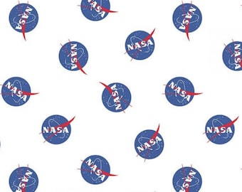 May include: White fabric with a repeating pattern of blue and red NASA logos. The logos are in a circle with the word "NASA" in white letters and a red wing.