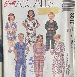 May include: McCall's sewing pattern for children's pajamas. The pattern features various pajama styles, including short sets, long sets, and nightgowns. The cover art shows illustrations of children wearing the different pajama designs. The pattern size is Z (Med-Lrg).