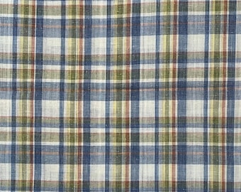May include: A close-up of a blue, green, and white plaid fabric. The fabric has a woven texture and a subtle sheen.