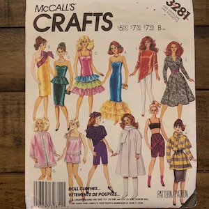 May include: A sewing pattern for doll clothes. The pattern includes 10 different outfits for 11-inch and 12-inch fashion dolls. The pattern is called McCall's Crafts 3281.