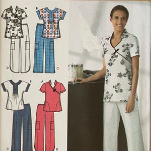 May include: A woman wearing a white floral print top and white pants. The image also shows pattern diagrams of various scrub top and pant sets in different colors and patterns, including floral and solid colors.