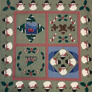 May include: A green and red patchwork quilt with a winter theme. The quilt features a variety of designs, including snowmen, candy canes, holly, and gingerbread men. The quilt is made of a variety of fabrics, including cotton and flannel.
