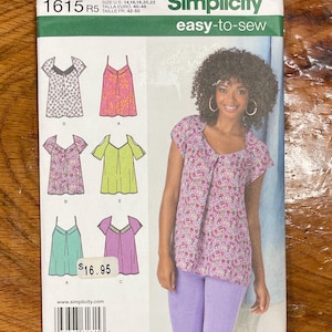 May include: Simplicity sewing pattern number 1615, size US 14-22, easy-to-sew, featuring five different styles of tops with a floral print, a green top, and a pink top. The pattern includes instructions for making a top with a scoop neck, a top with a V-neck, a top with a scoop neck and a ruffle, a top with a V-neck and a ruffle, and a top with a scoop neck and a ruffle.