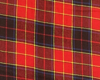 May include: Red, black, yellow, and blue plaid fabric with a woven texture.