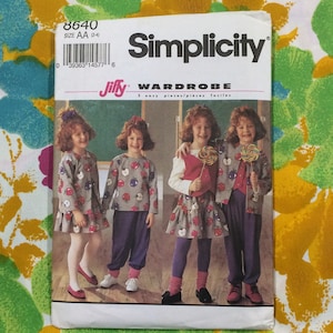 May include: Simplicity sewing pattern number 8640 for a Jiffy Wardrobe. The pattern is for sizes AA (2-4) and features four girls wearing different outfits with apple designs. The pattern includes five easy pieces.