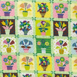 May include: A colorful fabric with a repeating pattern of various flowers and plants in pots. The fabric is a patchwork of squares with different colors and patterns. The flowers are in a variety of colors, including pink, blue, green, yellow, and red.