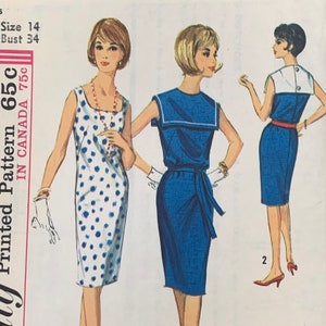 May include: A vintage sewing pattern for a dress. The pattern shows three different styles of dresses, one with polka dots, one with a sailor collar, and one with a contrasting collar. The pattern is for size 14, bust 34. The pattern is called "Printed Pattern 65c" and costs 75c in Canada.