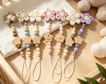 Personalized name-customizable pacifier clips – silicone and wood. A perfect baby christening gift for both boys and girls.