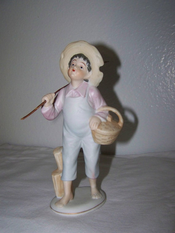 boy fishing figurine