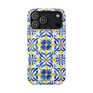 May include: A smartphone case featuring a repeating tile pattern in shades of blue, yellow, and white. The design consists of symmetrical floral motifs and geometric shapes. The text Westport Cove is printed in small black letters at the bottom.