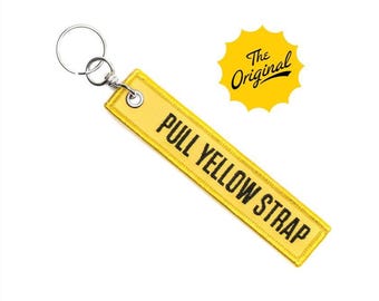 Pull Yellow Strap Keychain, Pull The Yellow Tab, Tug The Yellow Strap, Theme Park Key Chain Zipper Pull, Bag Charm, Pull Before Flight