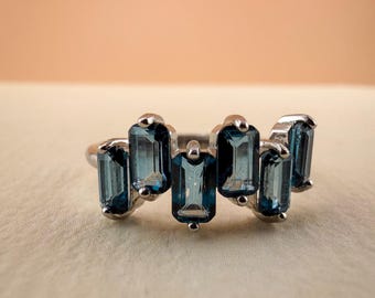 Swiss Blue Topaz Five-Stone Ring • Emerald Cut Gemstone, Silver-Plated Band (Adjustable)