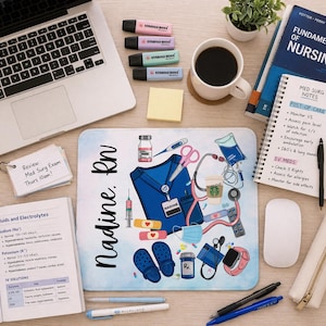 May include: A desk setup with a laptop, coffee, and nursing textbooks. A personalized mousepad features medical illustrations, a nurse's uniform, and the name "Nadine, RN." Highlighters, pens, and a notepad are also present.