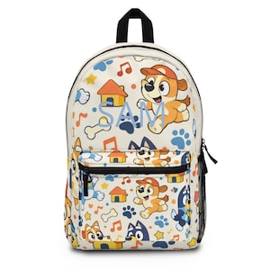 May include: A cream-colored backpack featuring a repeating pattern of cartoon dogs, houses, musical notes, stars, and paw prints. The name "SAM" is printed in light blue. The backpack has a black handle, zipper, and side mesh pocket.