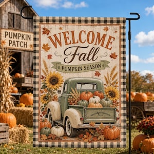May include: A rectangular garden flag featuring a black and white buffalo check border. The centre displays a vintage green pickup truck filled with orange pumpkins, sunflowers, and wheat stalks. Text reads Welcome Fall PUMPKIN SEASON.