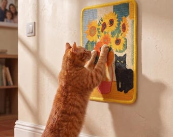 May include: A rectangular wall-mounted cat scratching pad featuring a woven design of yellow sunflowers in a vase and a black cat. The pad has a thick yellow border and is mounted on a wall, with an orange tabby cat scratching the surface.