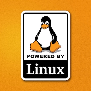 May include: A rectangular sticker featuring the Linux mascot, Tux the penguin, with a black body, white belly, and orange beak and feet. Below the penguin, the text reads POWERED BY in black letters, followed by the word Linux in white serif font.