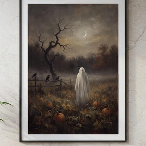 May include: A framed wall art print titled DIGITAL TREASURY PRINTS featuring a dark, moody landscape with a white sheet ghost standing in a pumpkin patch. A crescent moon hangs in the cloudy sky above a bare tree, a wooden fence, and three black crows.