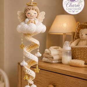 May include: A crocheted hanging ornament featuring an angel with tan hair, a gold halo, and white wings, resting on a white cloud. A spiral tail extends downwards, decorated with small white clouds, gold crocheted stars, pearls, and a gold bell.