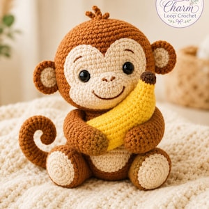 May include: A brown and cream crocheted monkey toy holding a yellow banana. The monkey has large black eyes, a small stitched smile, and a curled tail. A circular logo in the top right corner features a purple yarn ball and the text Charm Loop Crochet.