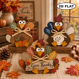 May include: Three 2D flat wooden turkey decorations for Thanksgiving. Each turkey features colorful patterned feathers, a raffia bow, and a wooden base. One turkey holds a sign that reads Give Thanks, while another holds a small orange pumpkin.