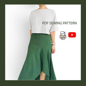 May include: A PDF SEWING PATTERN featuring a light gray short-sleeved top and a solid dark green midi skirt with an asymmetrical hemline. The image includes a printer icon and a YouTube play button icon to indicate digital instructions.