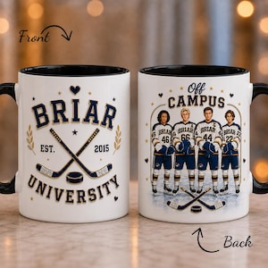 May include: Two white ceramic mugs with black handles and interiors. The front mug features the text BRIAR UNIVERSITY EST. 2015 with crossed hockey sticks and a puck. The back mug displays the text OFF CAMPUS with four hockey players.