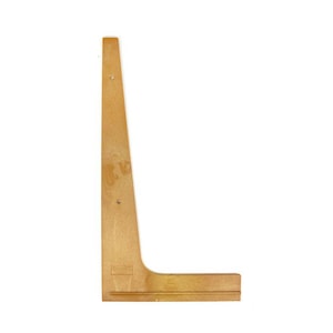 May include: A light brown wooden L-shaped shelf bracket with a smooth finish. The bracket features a tall vertical support and a shorter horizontal base, with two small circular holes visible along the vertical section for mounting purposes.