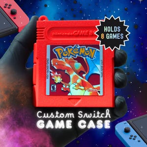 May include: A bright red custom game case shaped like a vintage handheld game cartridge. The label features a Charizard illustration with the text Pokemon. A black starburst graphic states HOLDS 8 GAMES. The text Custom Switch GAME CASE is visible.