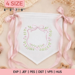 May include: White banner with a pink embroidered shield design, surrounded by a floral wreath. Pink ribbons are tied at the top corners. The banner is available in 4 sizes: 4", 5", 7", and 8".