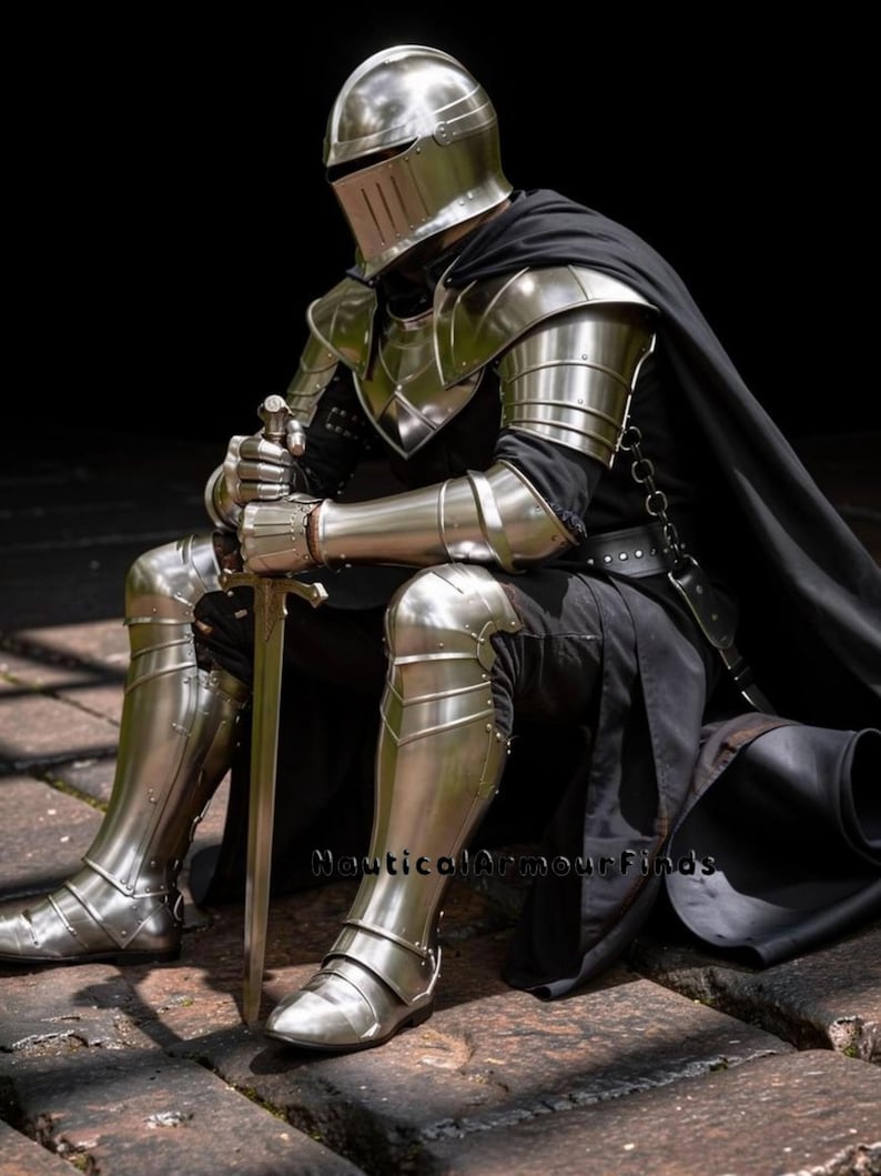 May include: A full suit of polished steel armor, including a helmet, shoulder guards, arm and leg protection, and boots. The knight is seated, holding a sword. A black cape drapes over the shoulders. The armor reflects the light, creating a metallic sheen.