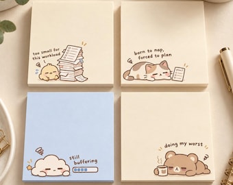 May include: Four square sticky note pads in cream and light blue. The cream pads feature a chick with a stack of papers labeled 'too small for this workload', a cat with 'born to nap, forced to plan', and a bear with 'doing my worst'. The blue pad shows a cloud with 'still buffering'.