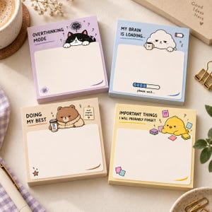 May include: Four square memo pads with cartoon illustrations. The purple pad says OVERTHINKING MODE with a cat. The blue pad says MY BRAIN IS LOADING... with a cloud. The beige pad says DOING MY BEST with a bear. The yellow pad says IMPORTANT THINGS I WILL PROBABLY FORGET with a chick.