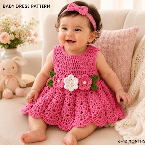 May include: A bright pink crochet baby dress with a matching headband featuring a bow. The dress has a scalloped hem and a waist detail of three crocheted flowers with pearl centers and green leaves. Text reads BABY DRESS PATTERN and 6-12 MONTHS.