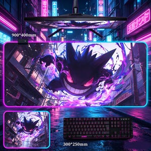 May include: A rectangular desk mat measuring 900 by 400 mm and a smaller 300 by 250 mm mat, both featuring a purple and black Gengar character graphic set against a neon-lit city street background with a glowing blue border and a black keyboard.