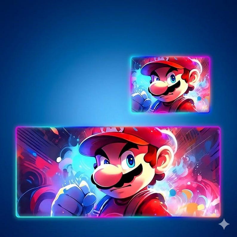 May include: A rectangular desk mat and a smaller matching rectangular mouse pad, both featuring a vibrant, colorful illustration of the character Mario with a red cap, blue eyes, and a mustache, set against a dynamic, glowing, multi-colored background.