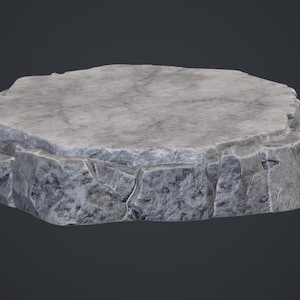 May include: A circular display base featuring a textured, light gray stone surface with jagged, rocky edges. The top is flat and smooth, while the sides exhibit a rugged, uneven appearance with deep cracks and crevices mimicking natural stone formations.