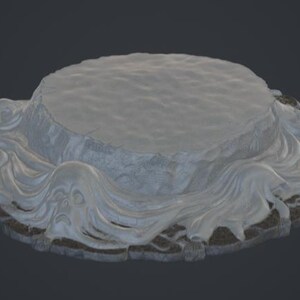 May include: A circular display base featuring a flat, textured gray top surface surrounded by a sculpted, flowing white liquid effect that cascades over the edges onto a dark, rugged, stone-like border with intricate, carved geometric patterns.
