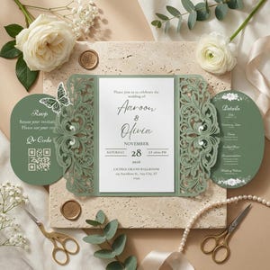 May include: A sage green laser-cut wedding invitation suite featuring a central white card with the text Aaroon & Olivia, November 28, 2026, Liceria Grand Ballroom. Includes a side RSVP panel with a QR code and a details panel with floral accents.