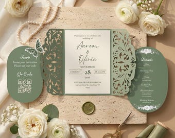 Könnte beinhalten: Ein salbeigrünes, lasergeschnittenes Hochzeitseinladungsset mit einer zentralen Karte mit dem Text Aaroon & Olivia, 28. November 2026, Liceria Grand Ballroom. Enthält eine ovale RSVP-Karte mit QR-Code und eine passende Detailkarte.