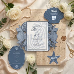 May include: A blue and white wedding invitation suite featuring a central card with shell-shaped die-cut side panels, an oval details card, a shell-shaped RSVP card with a QR code, and a starfish-shaped name tag, all decorated with shell motifs.
