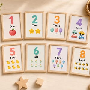 May include: Eight framed number cards with illustrations. Each card features a number from one to eight, along with the written word and a corresponding image, such as an apple for one, stars for two, and balloons for three.