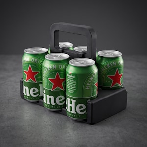 May include: A black plastic carrier holding six green Heineken beer cans. Each aluminium can features the iconic red star logo, white text, and silver pull-tab top. The carrier includes a central handle for easy transport of the beverage containers.