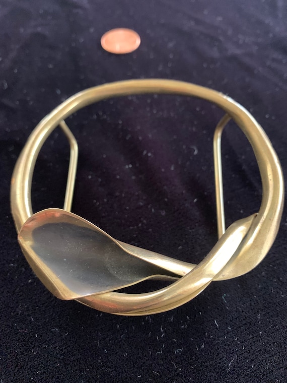 Brass belt or scarf buckle twisted