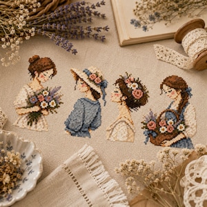 以下が含まれることがあります： ベージュのリネン生地に施されたクロスステッチ刺繍で、4人の人物が描かれています。茶色の髪、花のアクセント、ブーケ、つばの広い帽子、花でいっぱいの編みかごなどのアクセサリーを身につけた人物のデザインが特徴です。