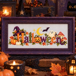 May include: A framed cross-stitch embroidery featuring the word Halloween in colourful letters, decorated with a purple witch hat, orange pumpkins, a yellow crescent moon, a black bat, a white ghost holding a lantern, and red mushrooms.