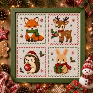 May include: A framed cross-stitch embroidery featuring four square panels with holiday-themed animals: a fox in a green scarf, a deer with holly, a hedgehog holding a red ornament, and a rabbit holding a green gift, all on a white fabric background.
