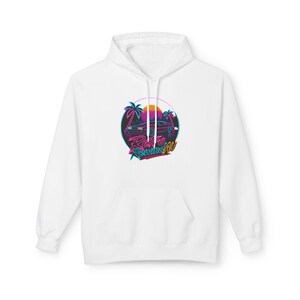 May include: White hooded sweatshirt with a front graphic. The graphic showcases a retro design with a car, palm trees, and the text "Retro Rewind AU" in neon pink, blue, and orange. It has a kangaroo pocket and a drawstring hood.