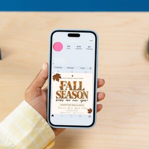May include: A smartphone displaying a social media profile with a post featuring the text FALL SEASON, books are now open, accepting new clients, and reserve your spot today. The graphic includes brown and orange leopard print maple leaf accents.