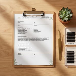 Lash lift consent form on a wooden clipboard at a lash artist station beside gold tweezers and lash extension trays, professional flat lay mockup.